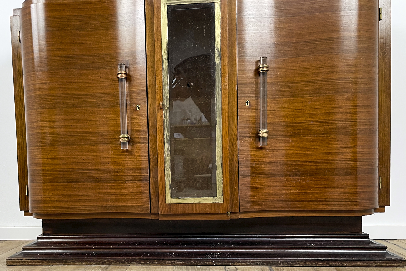 Art Deco chest of drawers in rosewood veneer with glass handles from France around 1925 with a display case